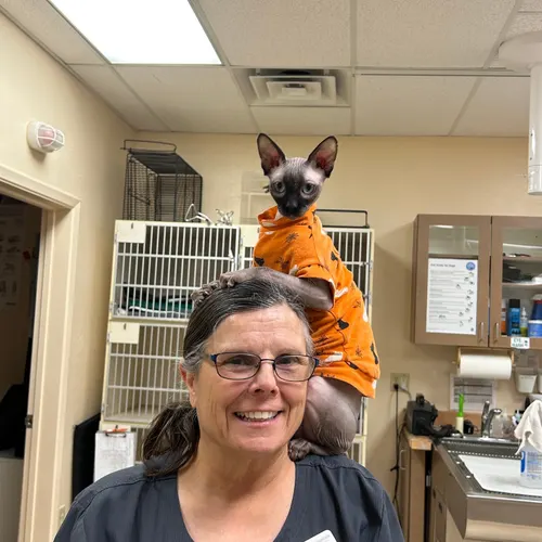 Dr. Phil in his orange shirt spending time with Donna at the hospital.